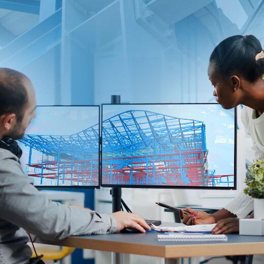 Structural steel detailing engineers reviewing BIM coordination and Tekla model drawings for a USA fabrication project